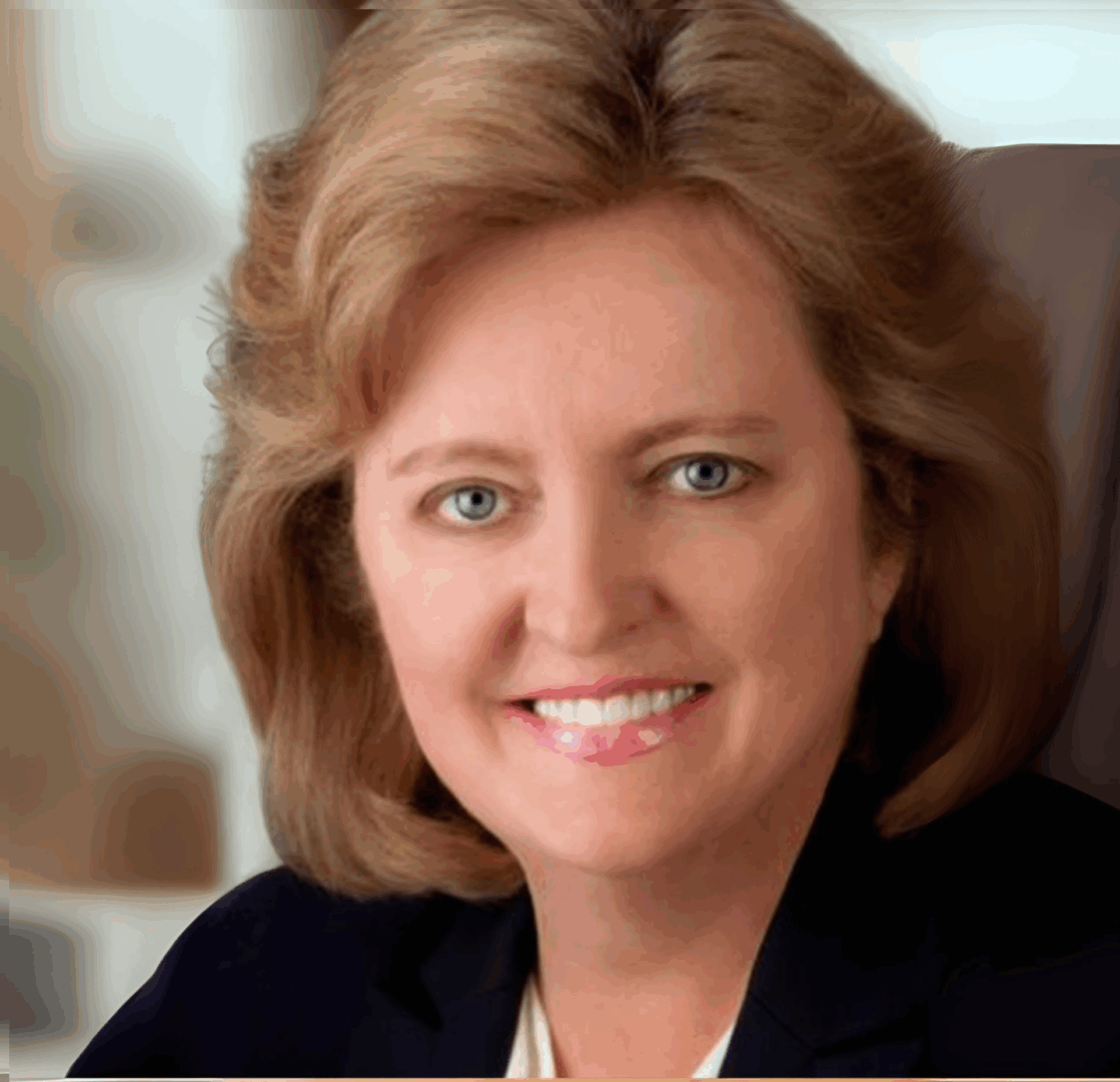 Smiling woman with short hair in portrait.