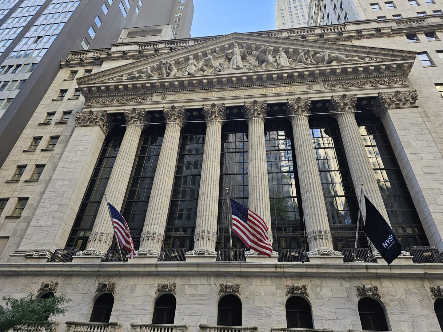New York Stock Exchange building with flags.